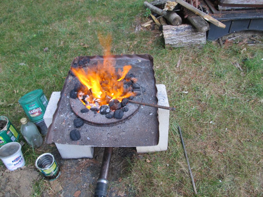 Completed charcoal forge built from scrap materials